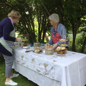 Beaufort House Akaroa 2020 House & Garden Tour Lady serving cake