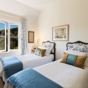 Bedroom with 2 single beds at Beaufort House luxury accommodation in Akaroa